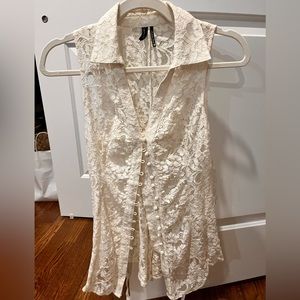 Sleeveless, white lace shirt